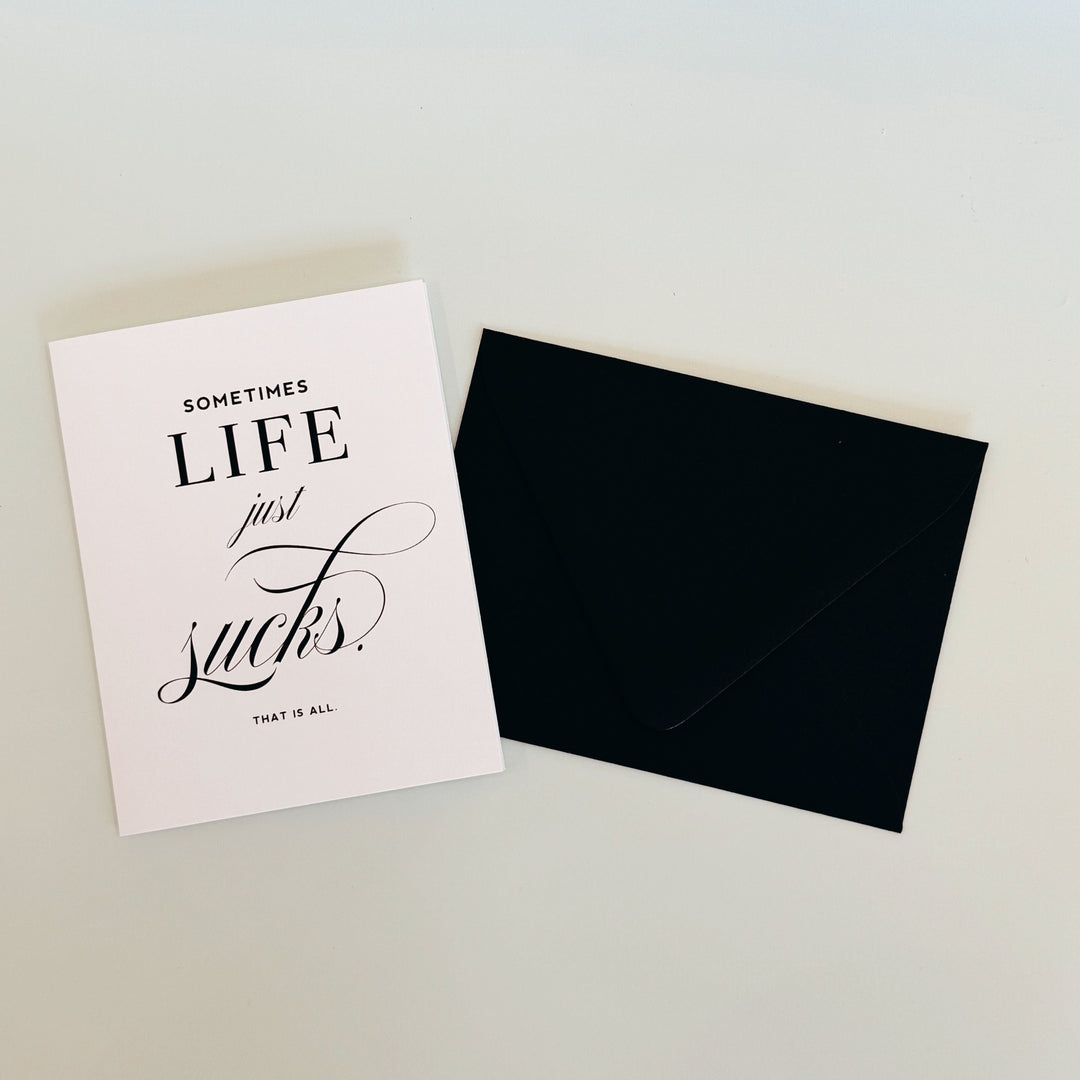 LIFE SUCKS GREETING CARD